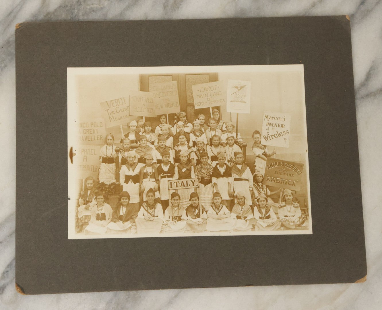 Lot 136 - Antique Boarded Photograph Of School Children Identified As The 6-B Girls, Participating In Celebration Of Italian History And Culture, With Many Hand Painted Signs, Full Identifications On Verso, Dated 1922