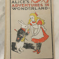 Lot 139 - "Alice's Adventures In Wonderland" Vintage Book By Lewis Carroll With 40 Illustrations By John Tenniel, W.B. Conkey, Publishers, Chicago, Early 20th Century, With Illustrated Cover, Note Slight Warping To Covers