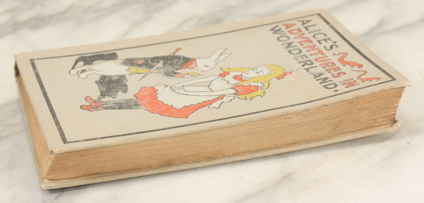 Lot 139 - "Alice's Adventures In Wonderland" Vintage Book By Lewis Carroll With 40 Illustrations By John Tenniel, W.B. Conkey, Publishers, Chicago, Early 20th Century, With Illustrated Cover, Note Slight Warping To Covers