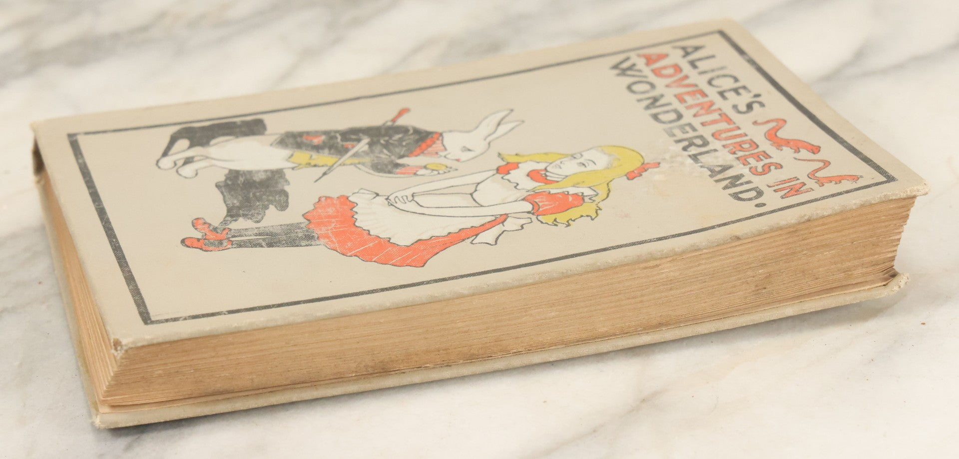 Lot 139 - "Alice's Adventures In Wonderland" Vintage Book By Lewis Carroll With 40 Illustrations By John Tenniel, W.B. Conkey, Publishers, Chicago, Early 20th Century, With Illustrated Cover, Note Slight Warping To Covers