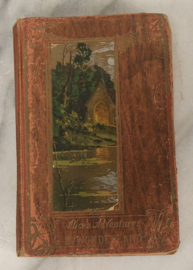 Lot 140 - "Alice's Adventures In Wonderland" Antique Book By Lewis Carroll With Burnt Red Art Nouveau Cover Design And Illustrations Throughout, Note Binding Wear, Circa Late 19th Century
