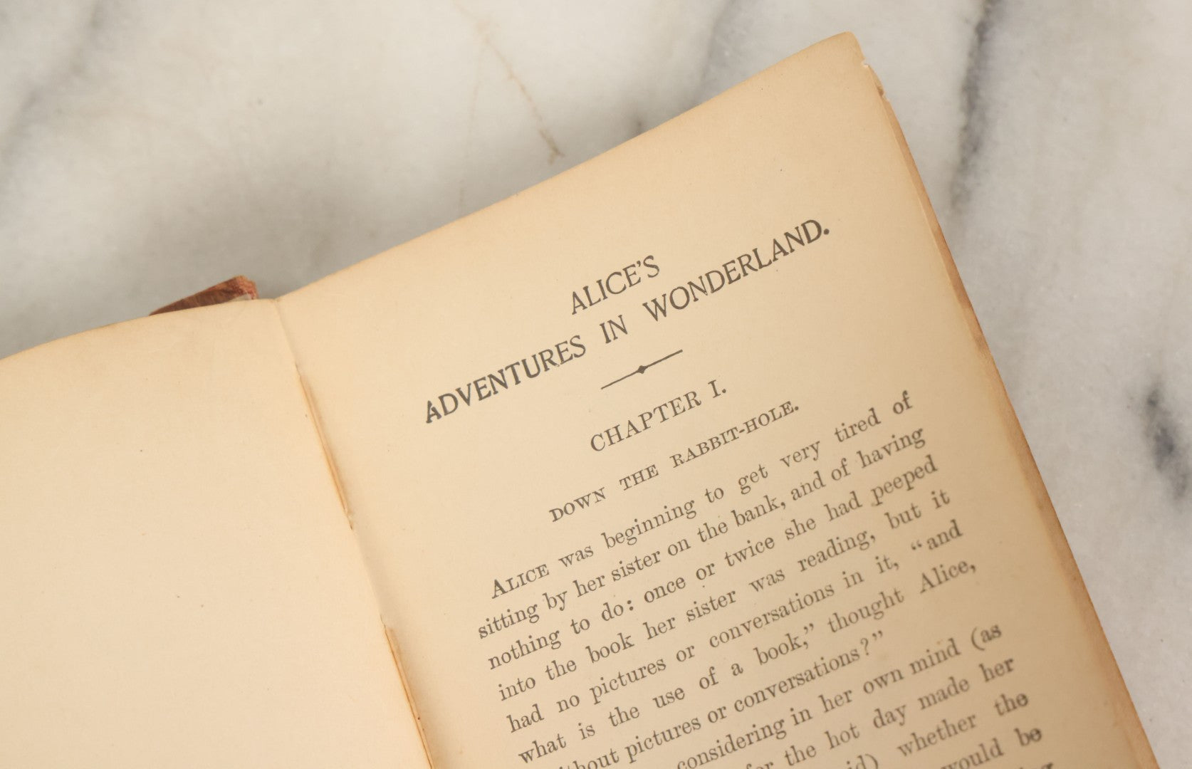Lot 140 - "Alice's Adventures In Wonderland" Antique Book By Lewis Carroll With Burnt Red Art Nouveau Cover Design And Illustrations Throughout, Note Binding Wear, Circa Late 19th Century