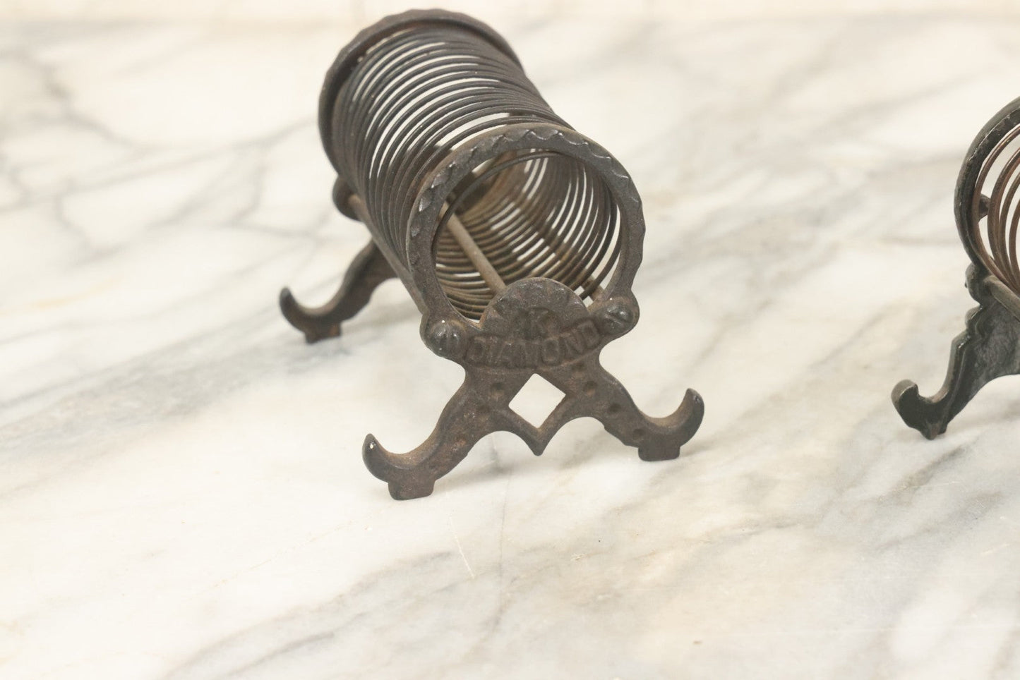 Lot 071 - Pair Of Vintage Cast Iron Spring Coil Letter Holders With Legs, Boots, One By K. Diamond, One By Mutat, No. 17 In Old Green Paint