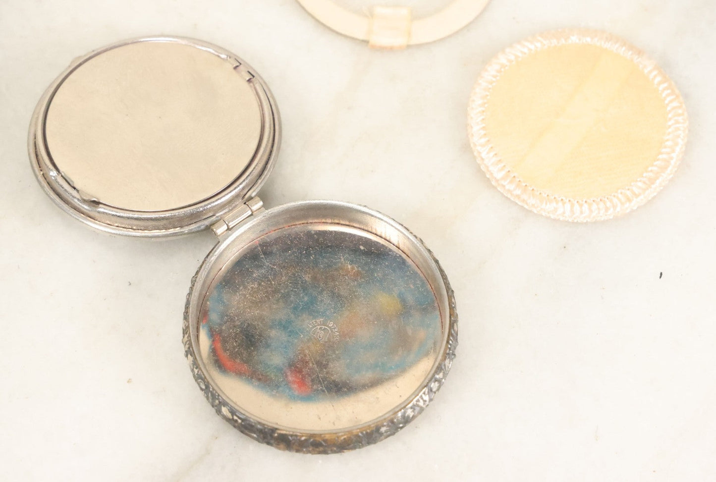 Lot 090 - Vintage Silverplate Compact With Floral Motif Edge And M.P. Monogram On Verso