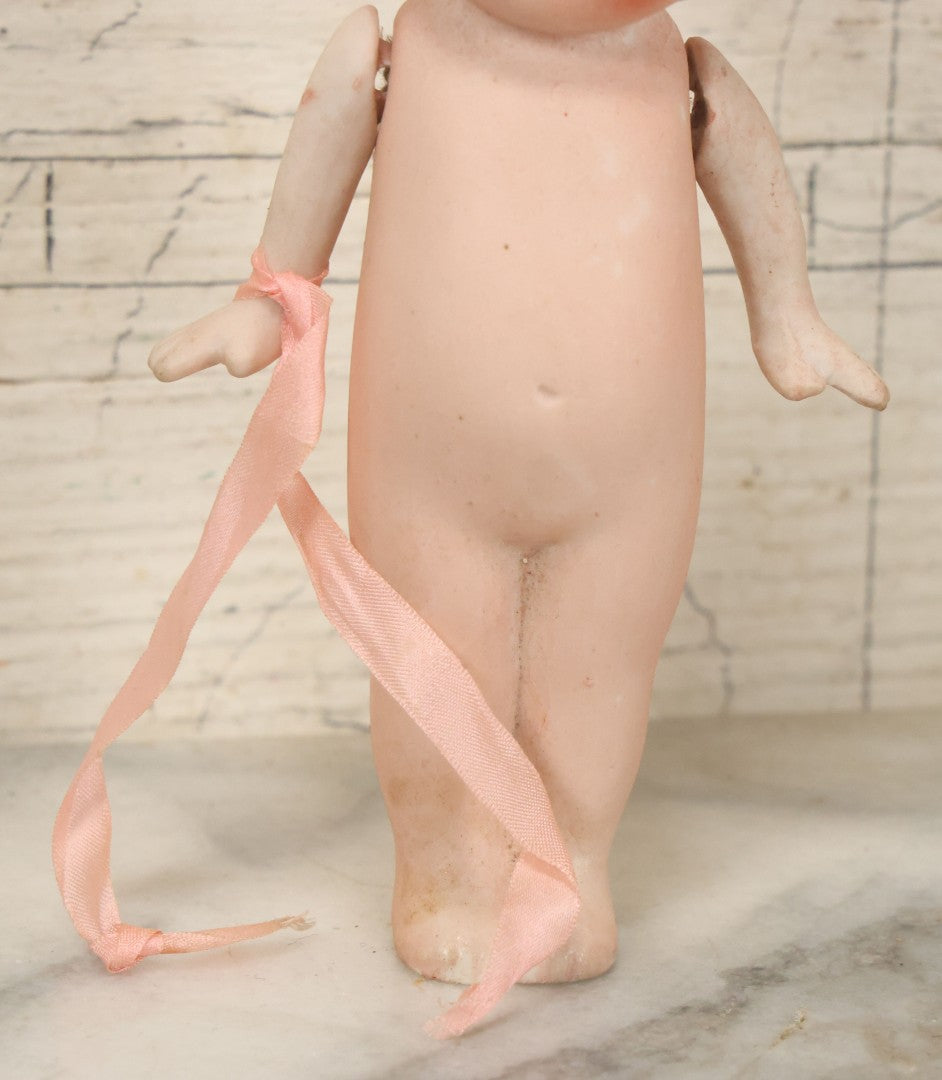 Lot 095 - Vintage Bisque Hand Painted Flapper Doll, Made In Japan, With Blond Hair And Pink Ribbon Around Wrist, Approximately 6" Height