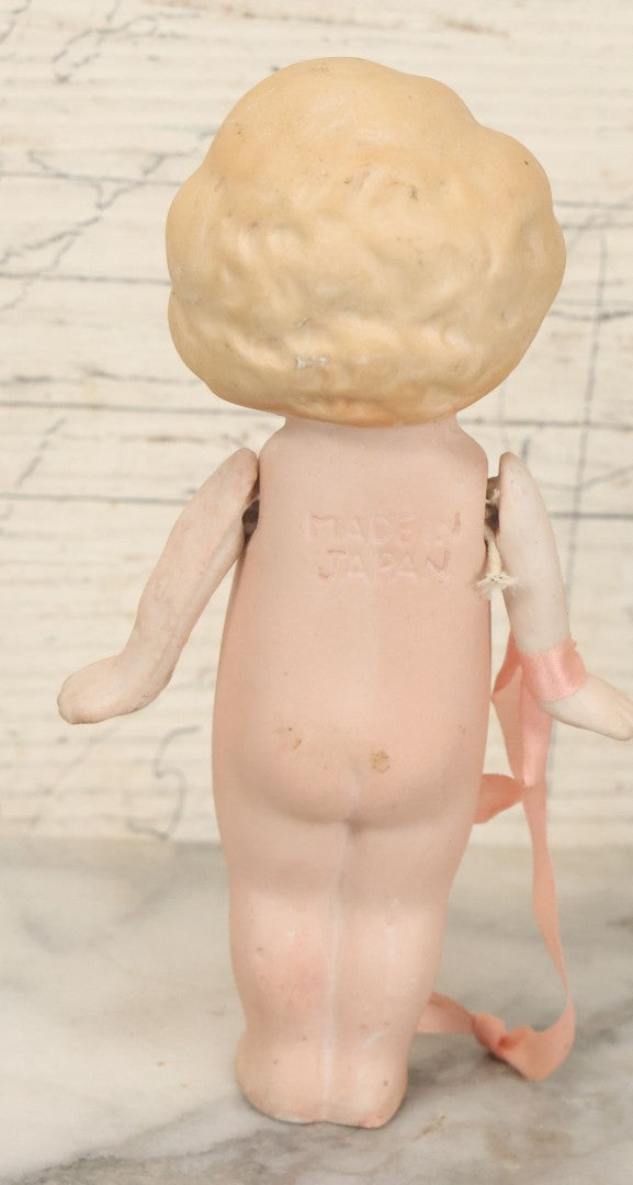Lot 095 - Vintage Bisque Hand Painted Flapper Doll, Made In Japan, With Blond Hair And Pink Ribbon Around Wrist, Approximately 6" Height