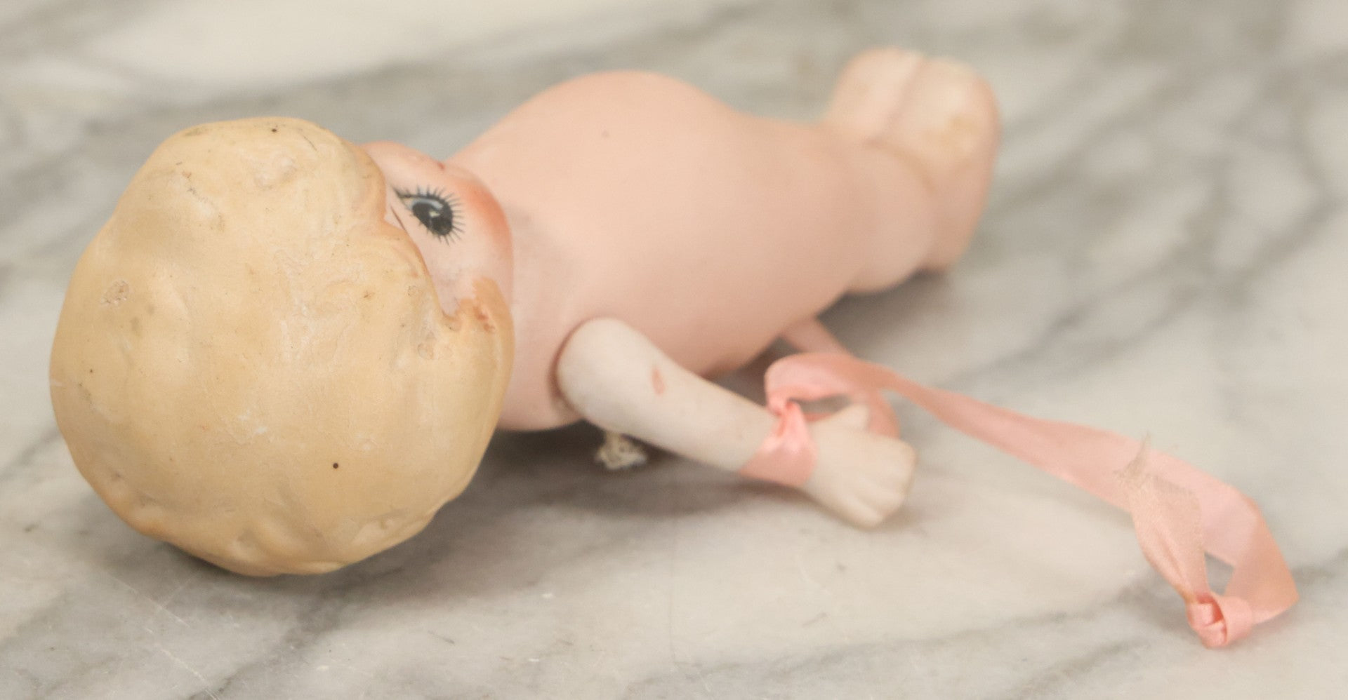 Lot 095 - Vintage Bisque Hand Painted Flapper Doll, Made In Japan, With Blond Hair And Pink Ribbon Around Wrist, Approximately 6" Height