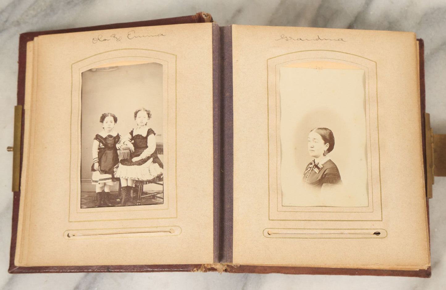 Lot 122 - Antique Cabinet Card And Tintype Family Photo Album, 10 C.D.V. Photos, 10 Tintypes, 4 Illustrated Album Filler Cards, Including Tintype Of Grandma Sherman In Mourning And C.D.V. Of Twin Girls