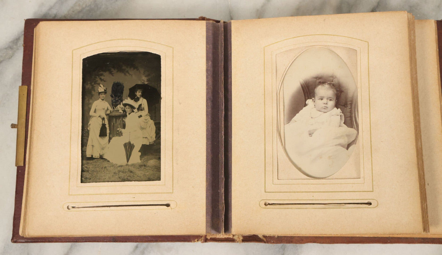 Lot 122 - Antique Cabinet Card And Tintype Family Photo Album, 10 C.D.V. Photos, 10 Tintypes, 4 Illustrated Album Filler Cards, Including Tintype Of Grandma Sherman In Mourning And C.D.V. Of Twin Girls