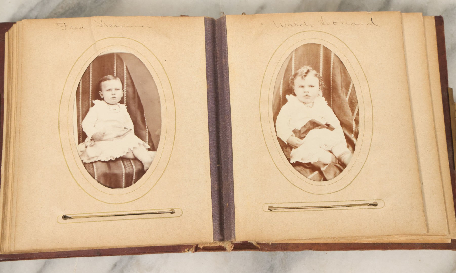 Lot 122 - Antique Cabinet Card And Tintype Family Photo Album, 10 C.D.V. Photos, 10 Tintypes, 4 Illustrated Album Filler Cards, Including Tintype Of Grandma Sherman In Mourning And C.D.V. Of Twin Girls