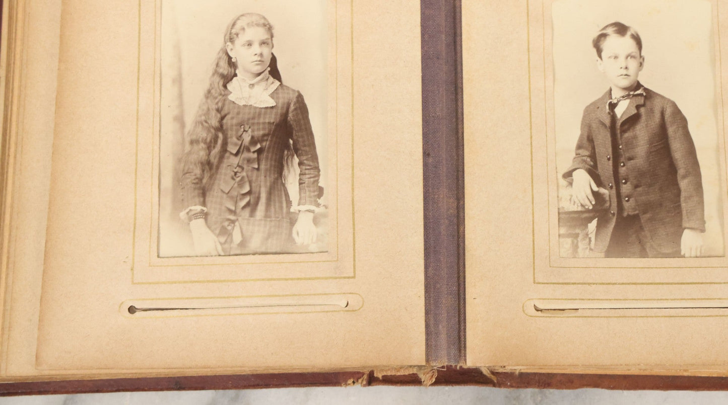 Lot 122 - Antique Cabinet Card And Tintype Family Photo Album, 10 C.D.V. Photos, 10 Tintypes, 4 Illustrated Album Filler Cards, Including Tintype Of Grandma Sherman In Mourning And C.D.V. Of Twin Girls