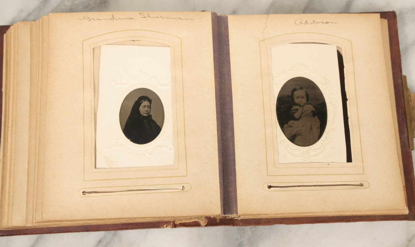 Lot 122 - Antique Cabinet Card And Tintype Family Photo Album, 10 C.D.V. Photos, 10 Tintypes, 4 Illustrated Album Filler Cards, Including Tintype Of Grandma Sherman In Mourning And C.D.V. Of Twin Girls