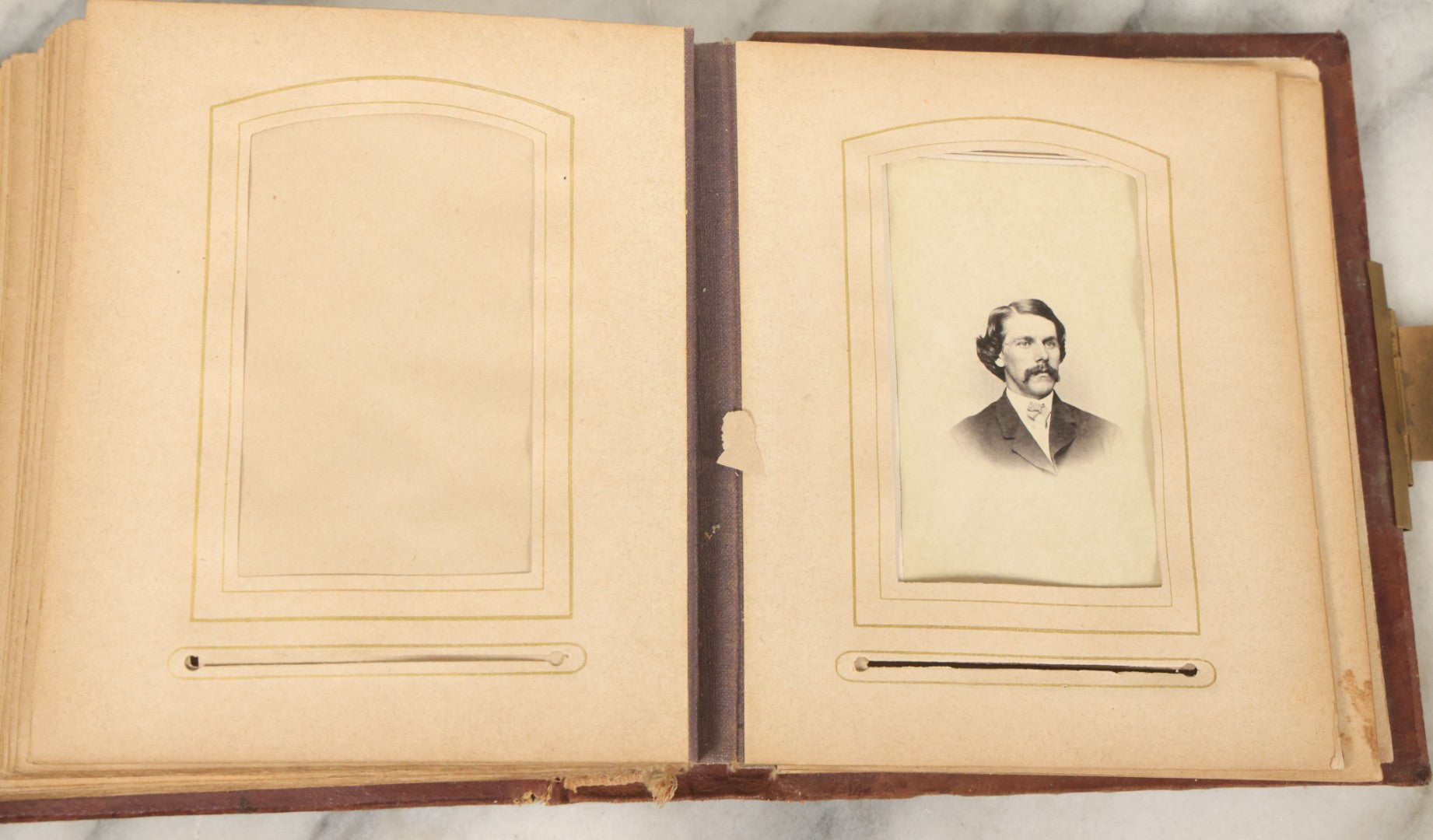 Lot 122 - Antique Cabinet Card And Tintype Family Photo Album, 10 C.D.V. Photos, 10 Tintypes, 4 Illustrated Album Filler Cards, Including Tintype Of Grandma Sherman In Mourning And C.D.V. Of Twin Girls