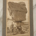 Lot 133 - Antique Boarded Photograph Of Two Men On Donkeys Posing In Front Of Large Balancing Rock Formation