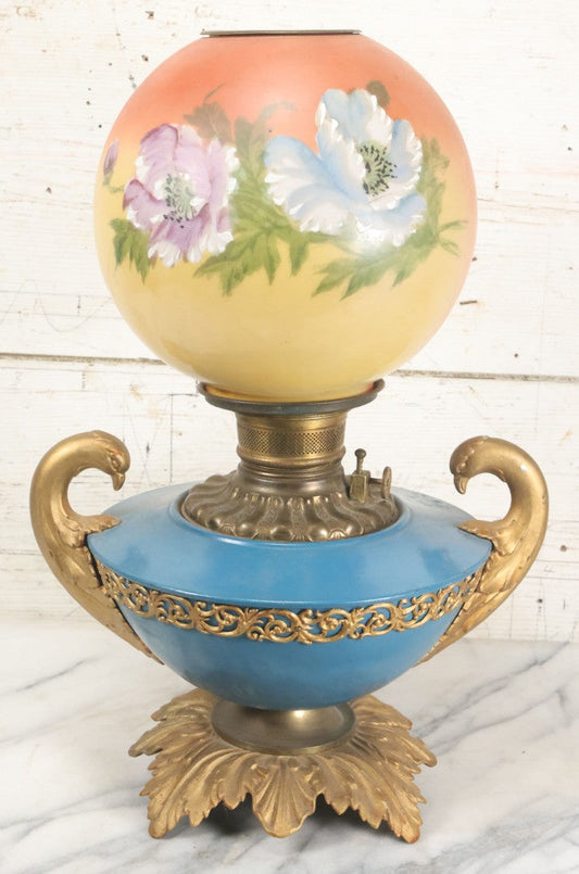 Lot 003 - Antique Kerosene Oil Lamp With Painted Blue Tin Font, Dove Head Motif, And Hand Painted Globe With Floral Motif By Pittsburgh Lamp And Brass, Made In America, Note Cracked And Repaired Section Of Globe, 19" High