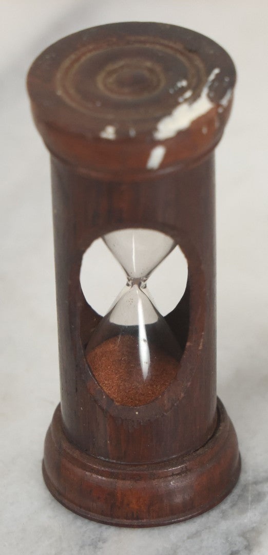 Lot 110 - Vintage Red Sand Hourglass In Turned Wooden Holder With Threaded Tops, Note Chips In Wood, Paint Marks, 2-5/8" Height