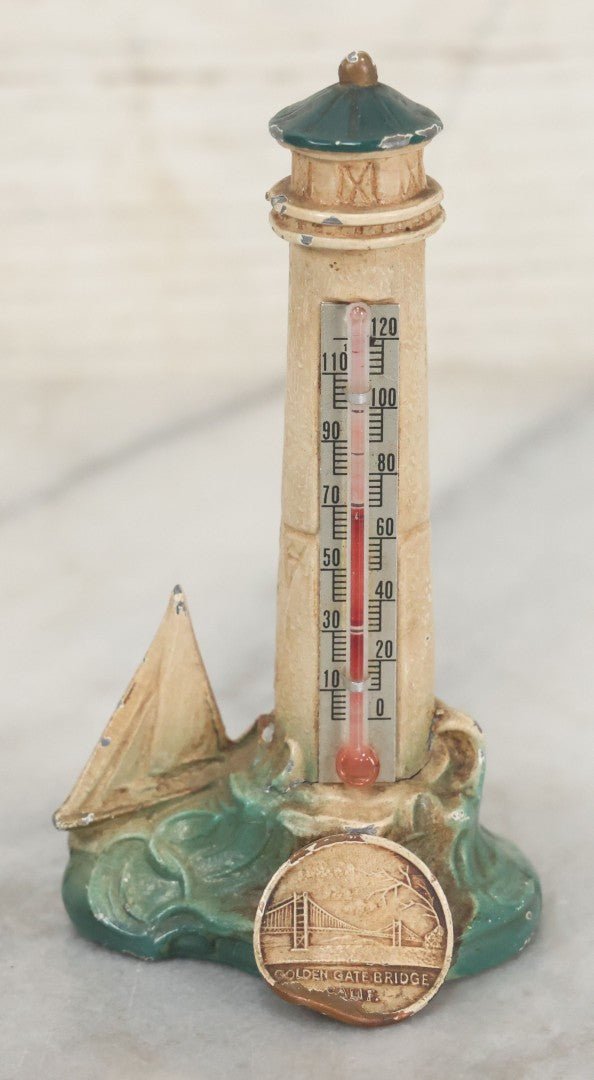 Lot 111 - Vintage Cold Painted Cast Pot Metal Souvenir Lighthouse And Sailboat Thermometer From Golden Gate Bridge, San Francisco California