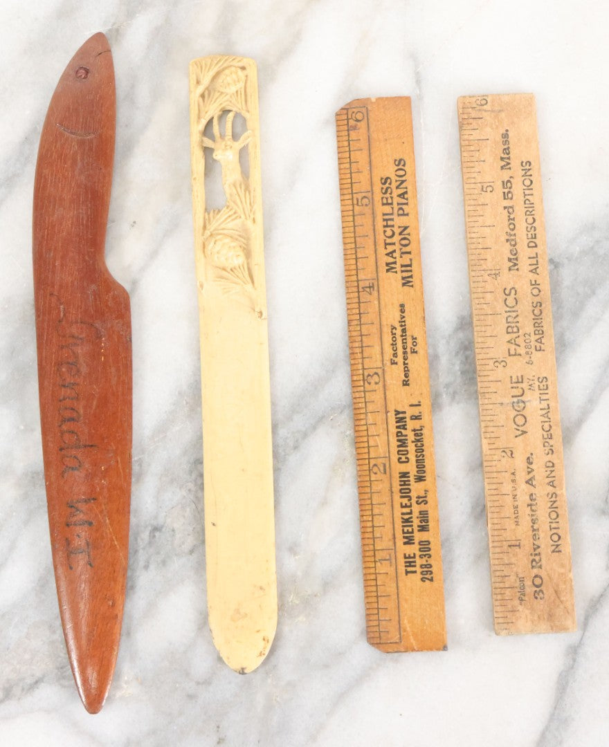Lot 121 - Grouping Of Vintage Desk Tools Including Two Advertising Rulers, Carved Fish Letter Opener, And Celluloid Pronghorn Page Turner