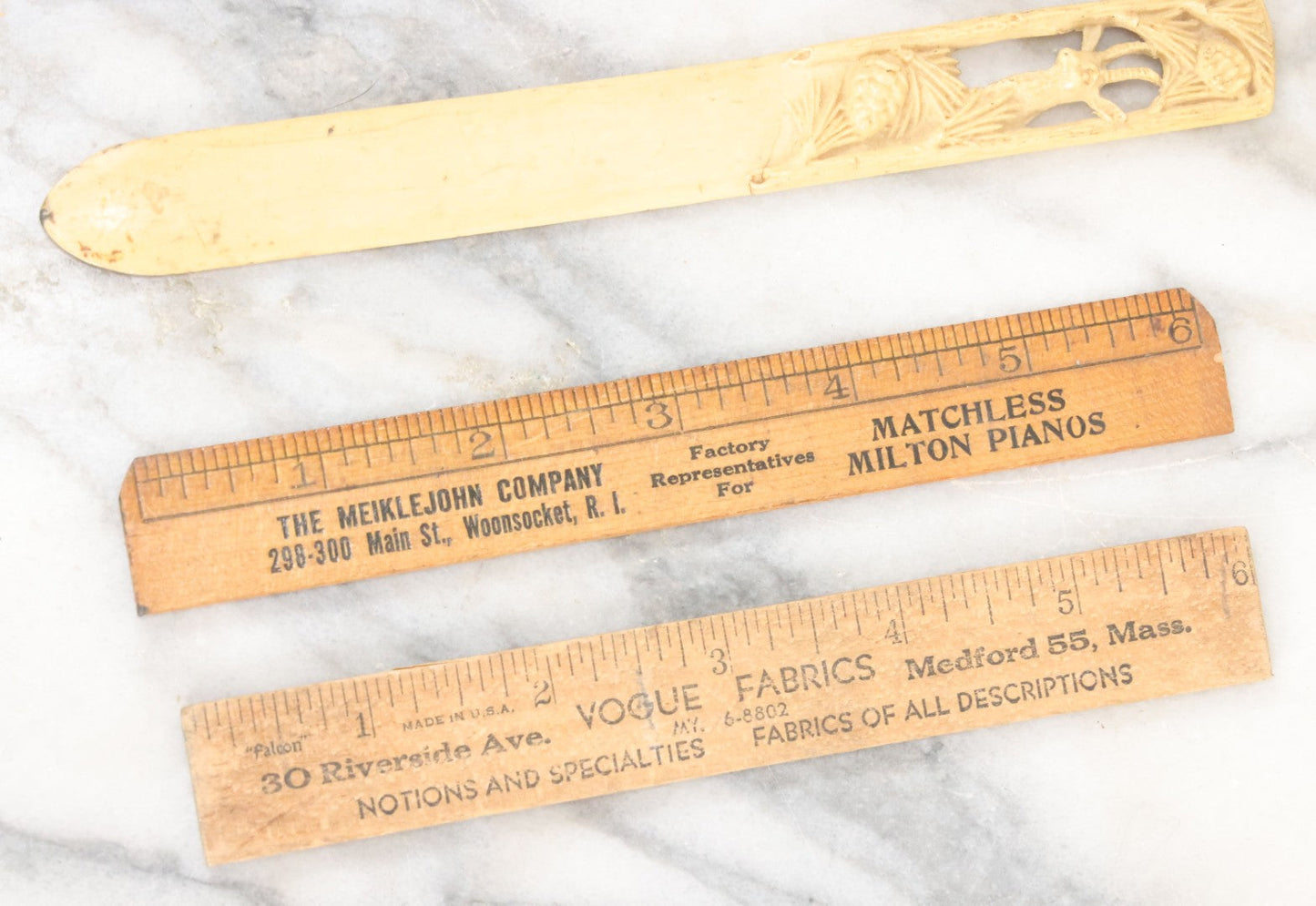 Lot 121 - Grouping Of Vintage Desk Tools Including Two Advertising Rulers, Carved Fish Letter Opener, And Celluloid Pronghorn Page Turner