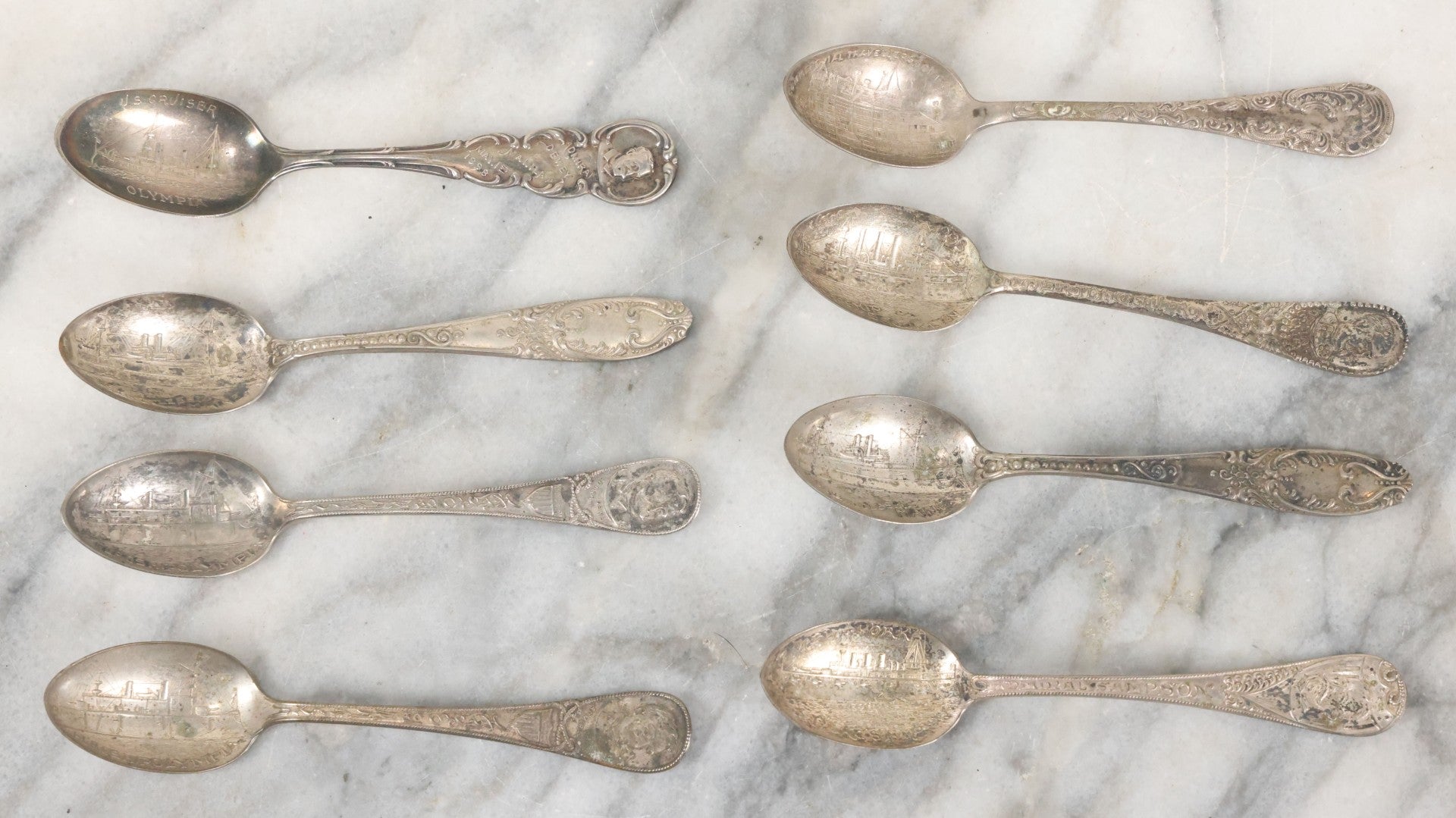 Lot 122 - Grouping Of 8 Antique Souvenir Spoons Relating To Ships And Leaders Of The Spanish American War Including The U.S. Battleship Maine, The Flagship New York, And Others, Manufactured By George E. Homer, Boston