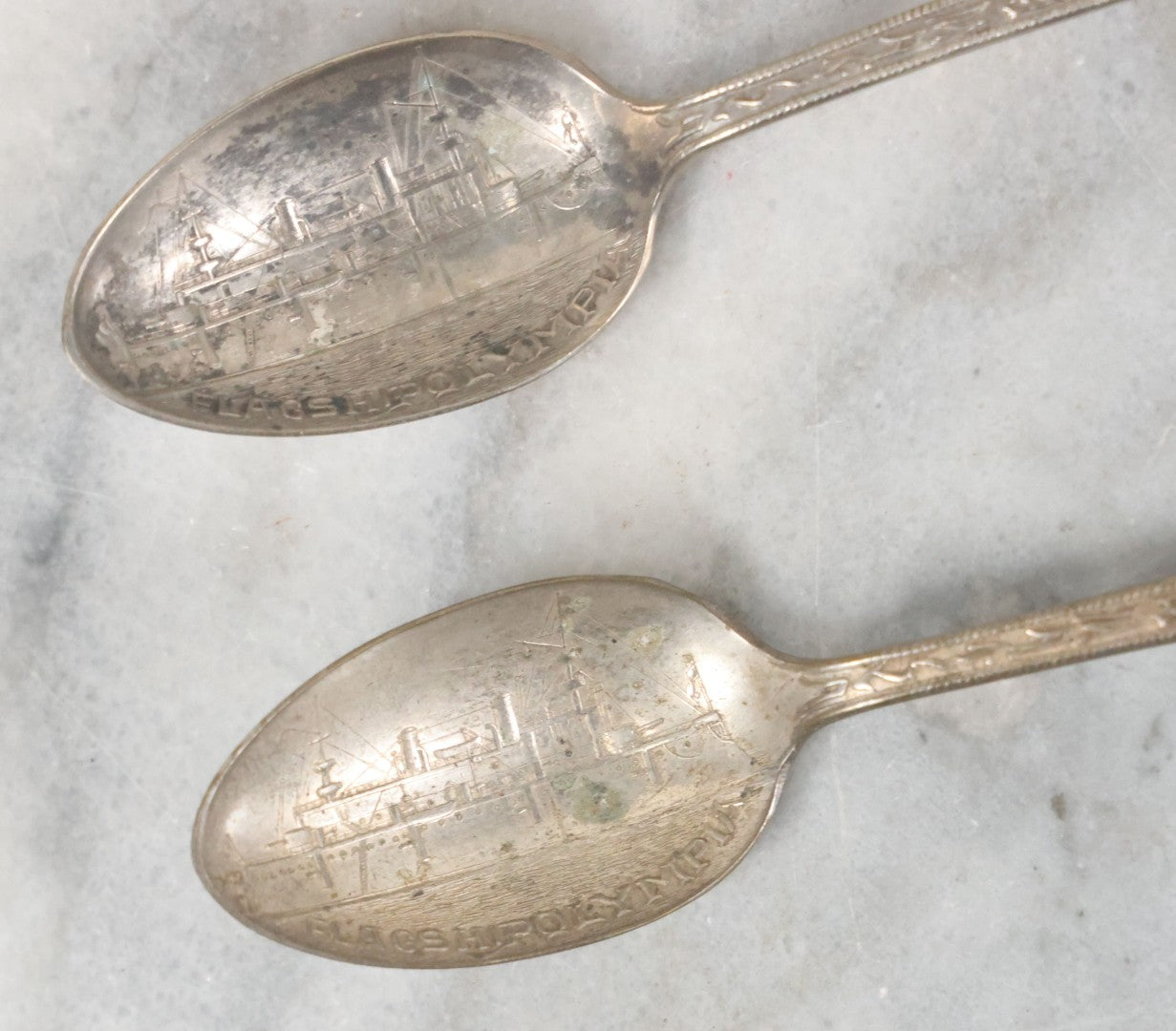 Lot 122 - Grouping Of 8 Antique Souvenir Spoons Relating To Ships And Leaders Of The Spanish American War Including The U.S. Battleship Maine, The Flagship New York, And Others, Manufactured By George E. Homer, Boston