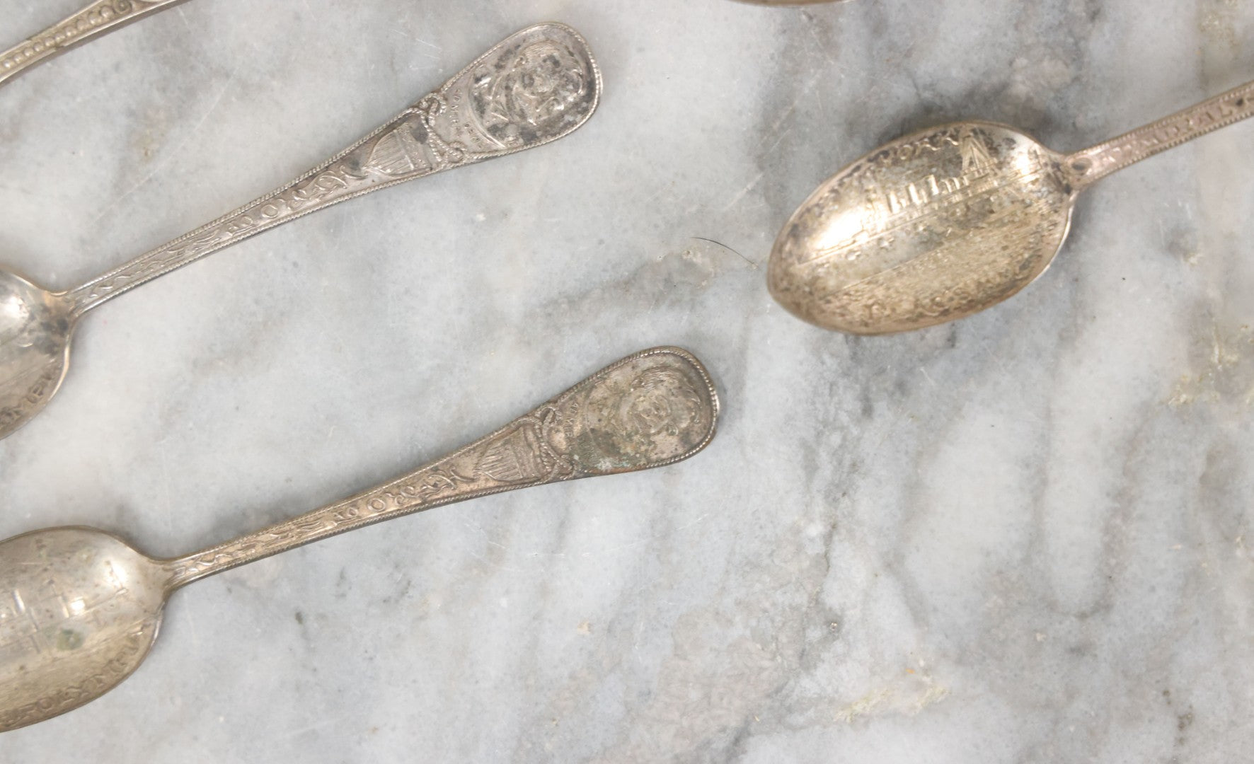 Lot 122 - Grouping Of 8 Antique Souvenir Spoons Relating To Ships And Leaders Of The Spanish American War Including The U.S. Battleship Maine, The Flagship New York, And Others, Manufactured By George E. Homer, Boston