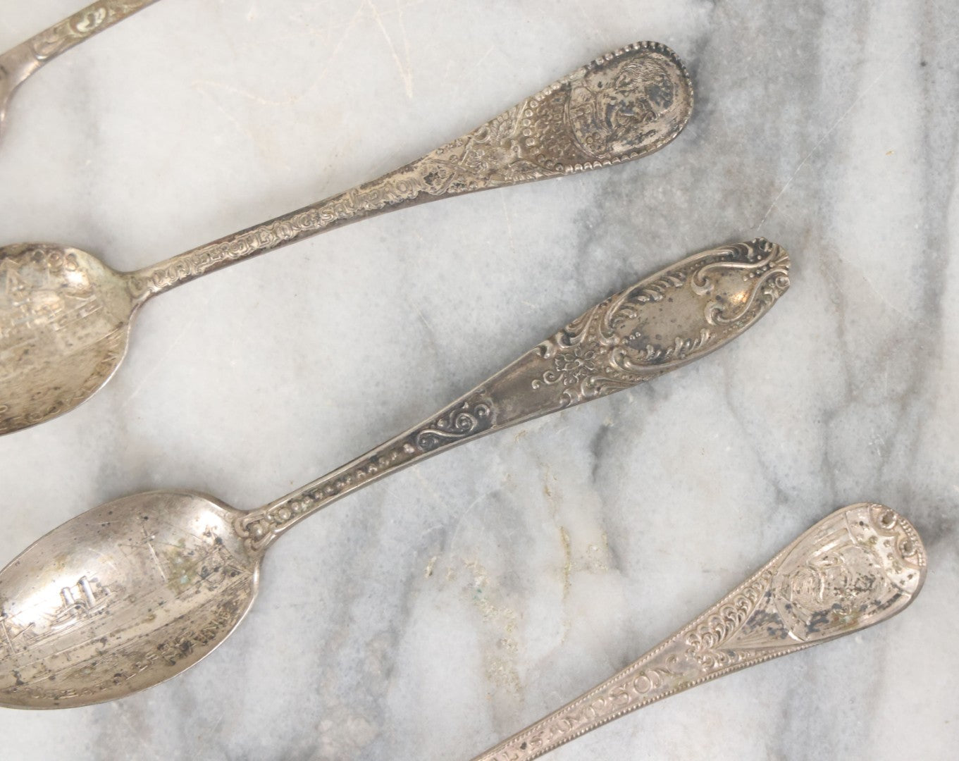 Lot 122 - Grouping Of 8 Antique Souvenir Spoons Relating To Ships And Leaders Of The Spanish American War Including The U.S. Battleship Maine, The Flagship New York, And Others, Manufactured By George E. Homer, Boston