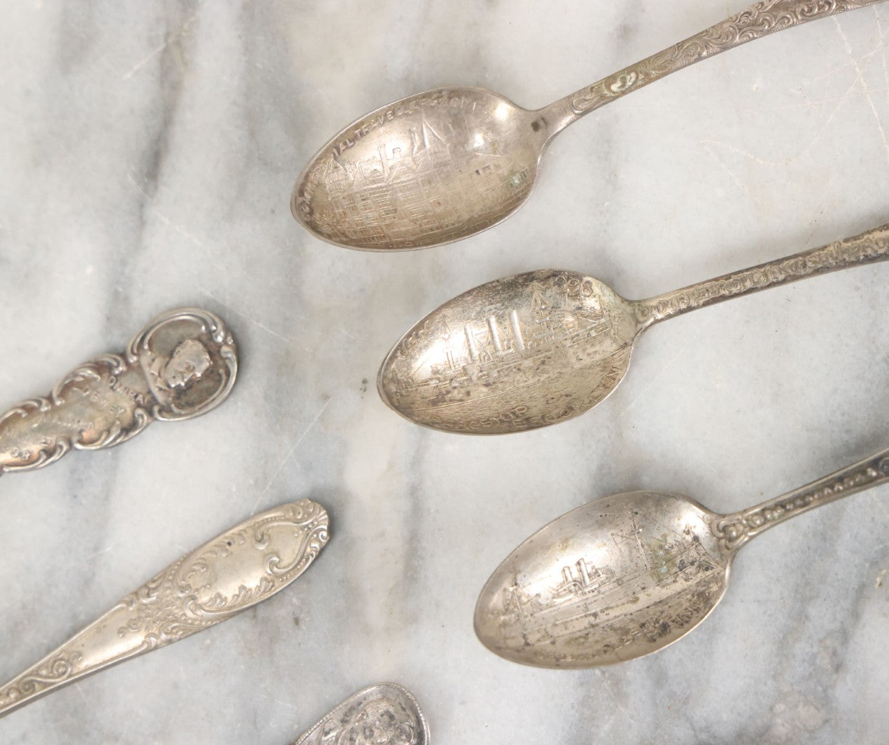Lot 122 - Grouping Of 8 Antique Souvenir Spoons Relating To Ships And Leaders Of The Spanish American War Including The U.S. Battleship Maine, The Flagship New York, And Others, Manufactured By George E. Homer, Boston
