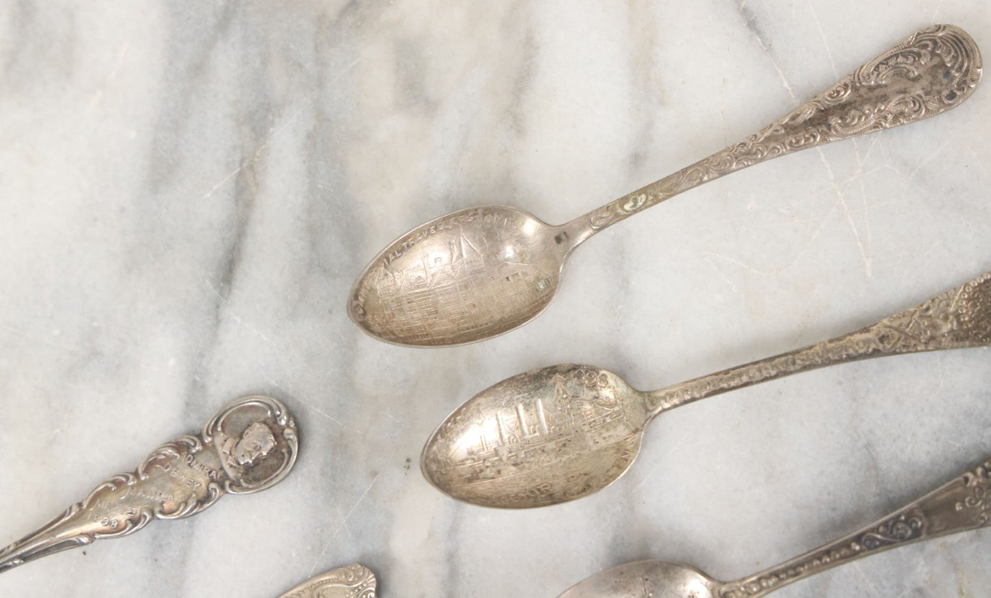Lot 122 - Grouping Of 8 Antique Souvenir Spoons Relating To Ships And Leaders Of The Spanish American War Including The U.S. Battleship Maine, The Flagship New York, And Others, Manufactured By George E. Homer, Boston