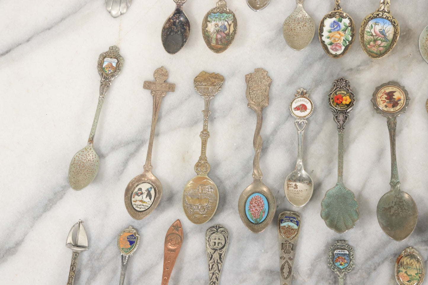 Lot 123 - Grouping Of 37 Souvenir Spoons Mostly From Travel, Landmarks, Etc., Including Sea World, Hawaii, And Many Other States