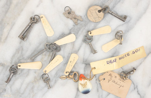 Lot 124 - Grouping Of 10+ Antique Furniture And Other Skeleton Keys With Custom Carved Bone Key Tag Keychains, Including Lucite Eagle Keychain Sold By A Deaf Mute Person