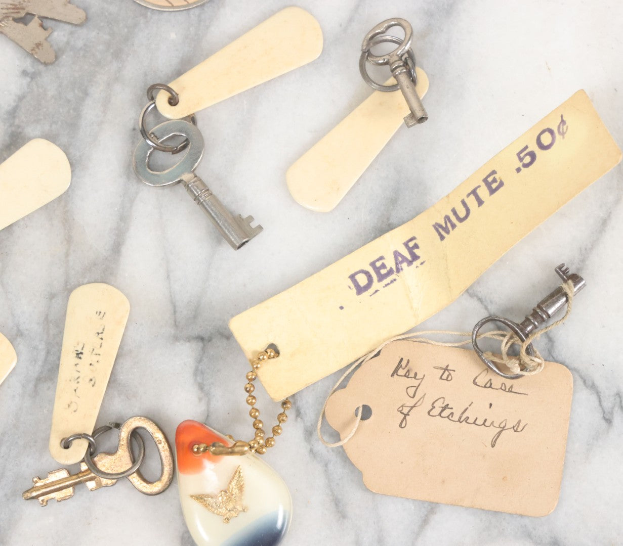 Lot 124 - Grouping Of 10+ Antique Furniture And Other Skeleton Keys With Custom Carved Bone Key Tag Keychains, Including Lucite Eagle Keychain Sold By A Deaf Mute Person