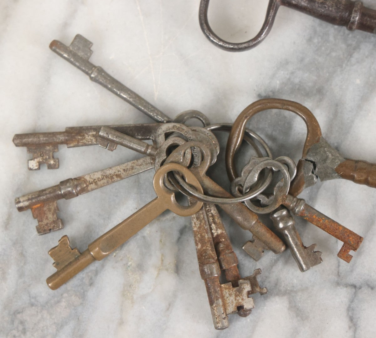 Lot 125 - Grouping Of 10+ Antique Skeleton Keys Including Two Large Gate Keys, Barrel Keys, And Others, Note One Large Key Has Crack