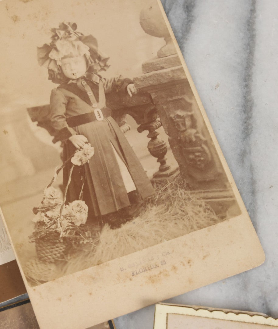 Lot 127 - Grouping Of 10 Antique And Vintage Cabinet Card And Other Photographs Including Little Girl With Hula Hoop, Men With Bowler Hats, Girl With Flower Basket, Girl In Foliage, And Little Boy Dressed As Cowboy