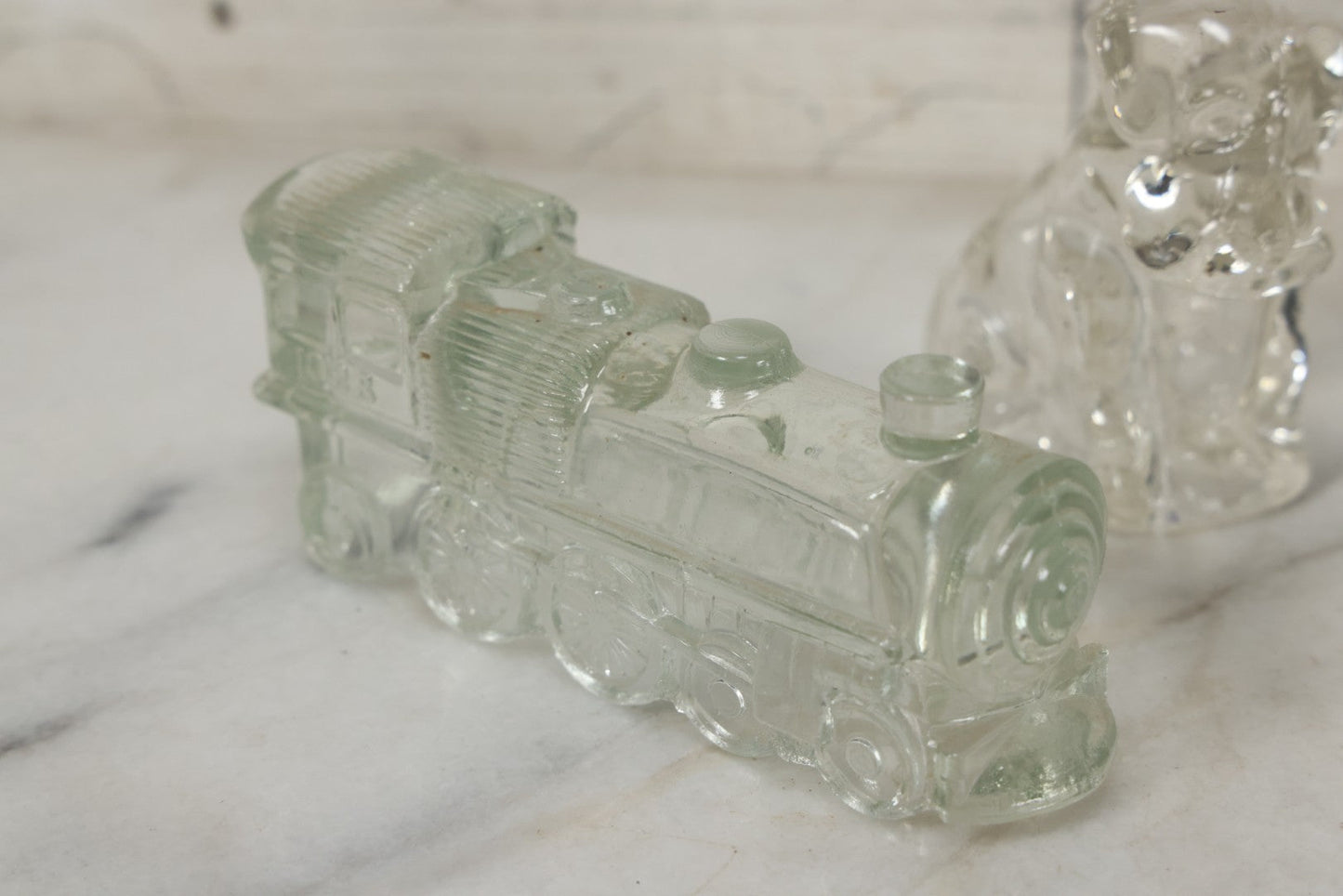 Lot 157 - Grouping Of Five Vintage Clear Glass Candy Containers Including Train, Firetruck, Two Dogs, And Military Cap Hat