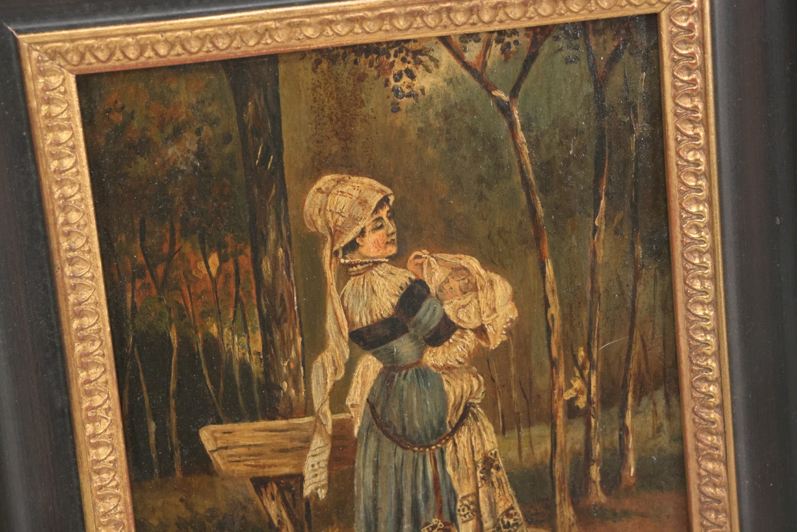 Lot 008 - Antique Painting On Wood Panel Of Victorian Woman In Blue Dress Holding Swaddled Baby By Park Bench, Unsigned, In Modern Frame, 9-1/2" x 11-7/8"