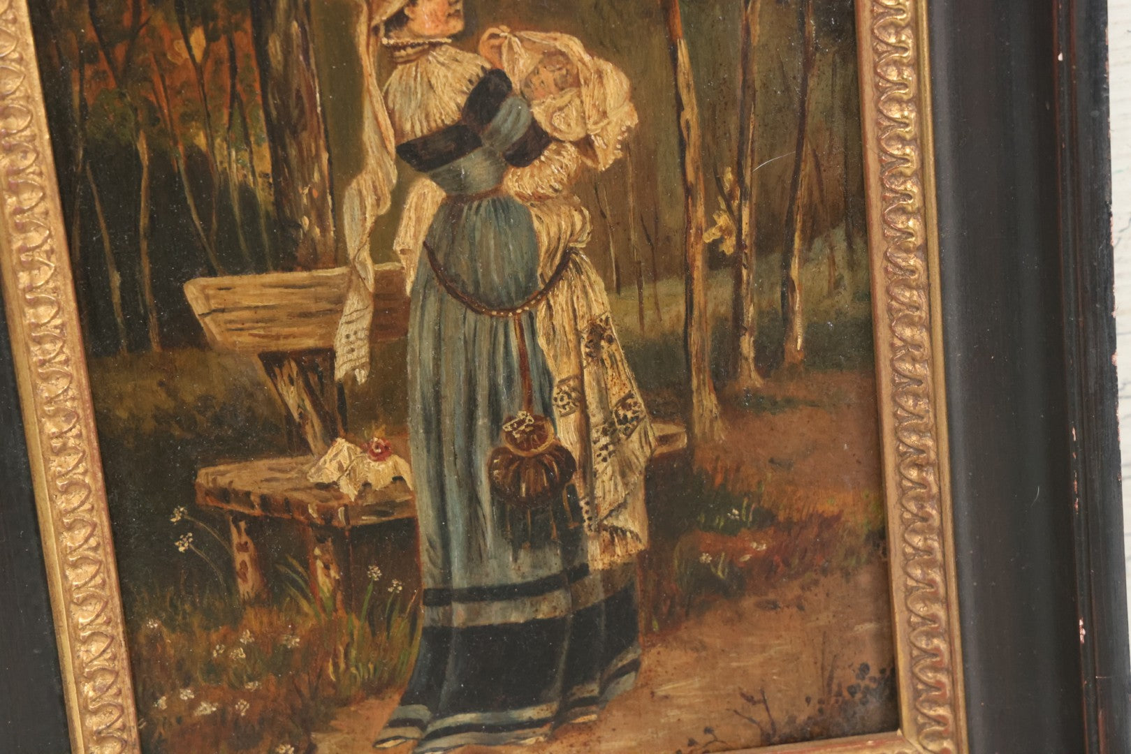 Lot 008 - Antique Painting On Wood Panel Of Victorian Woman In Blue Dress Holding Swaddled Baby By Park Bench, Unsigned, In Modern Frame, 9-1/2" x 11-7/8"
