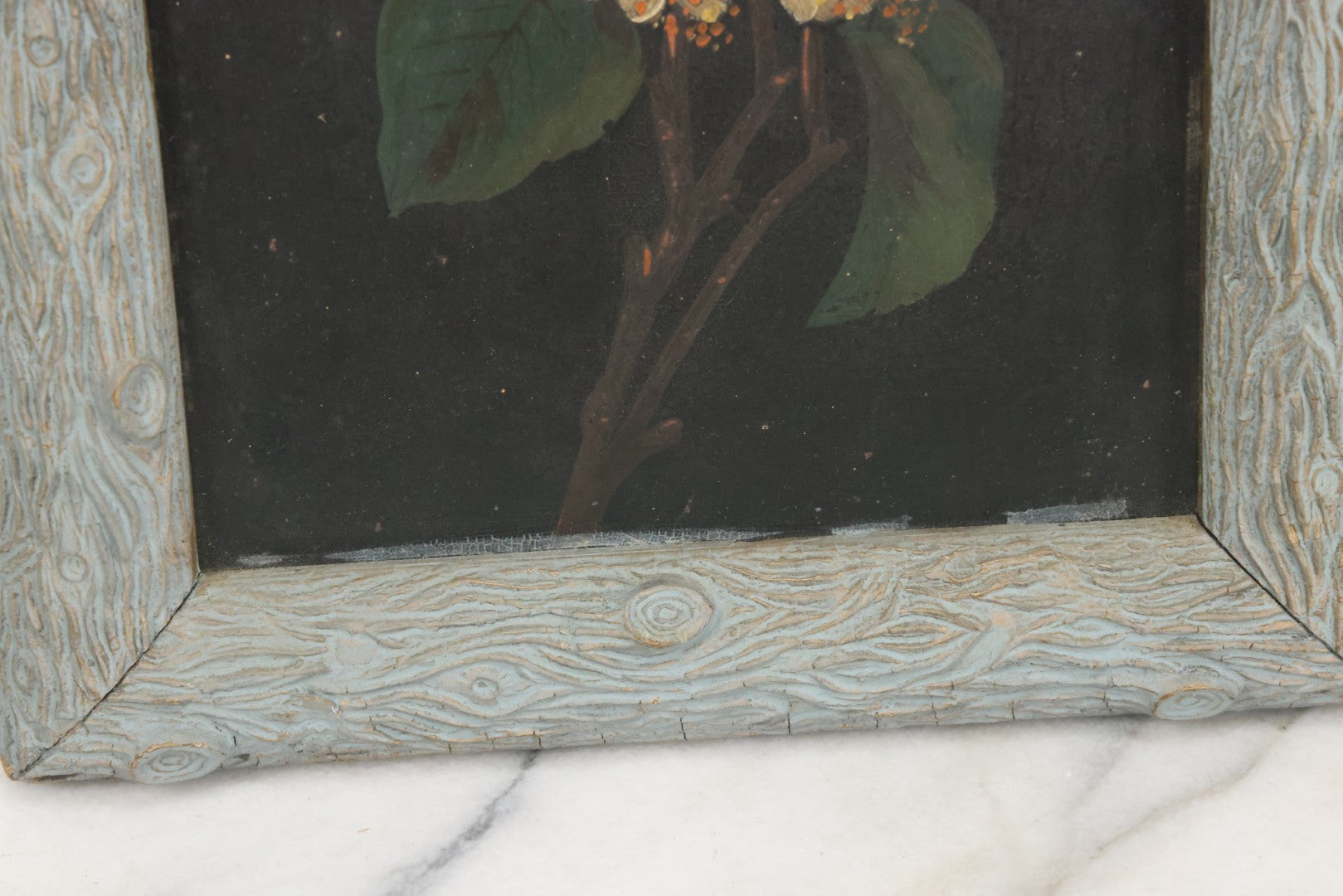 Lot 009 - Antique Painting On Tin Of White Flowers With Yellow And Orange Buds And Green Leaves In Original Faux-Branch Frame, 9-5/8" x 22-1/2"
