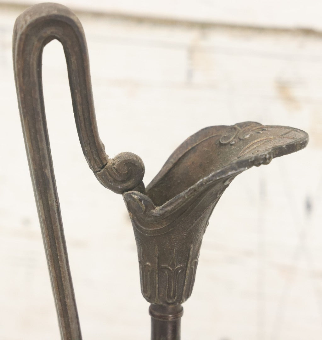Lot 011 - Pair Of Antique Ornate Cast Pot Metal Ewers, With Woman's Head On Handle, And Woman's Head In Profile, Greek Key Design, Note Crack In Handle And Crack On Base Of One, 10-5/8" High Each