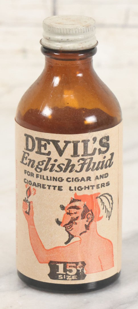 Lot 040 - Vintage Devil's English Fluid Lighter Fluid Bottle With Original Paper Label, Empty, By Devil Laboratories Co., Cincinnati Ohio, 15 Cent Size