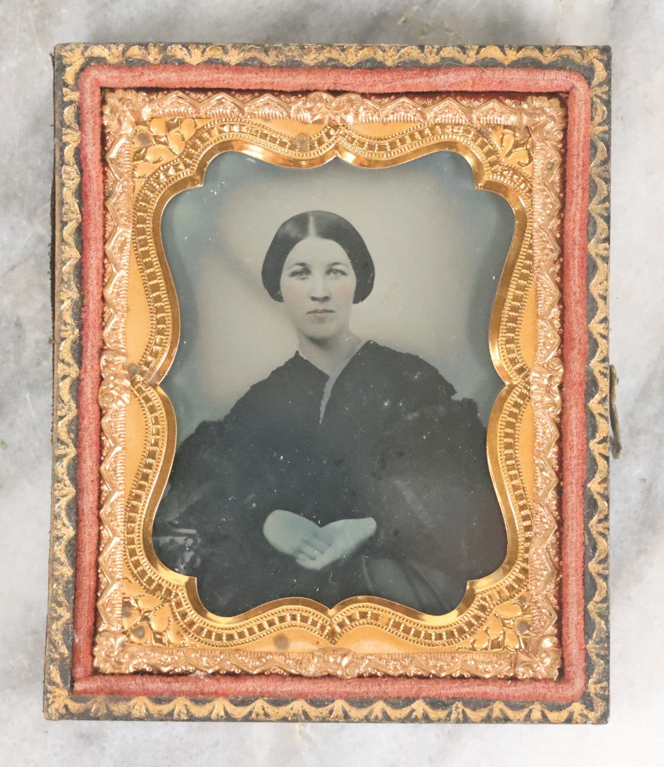 Lot 057 - Antique 1/9th Plate Ambrotype Photograph Of Pretty Young Woman With Slight Smile And Bob Hairdo, In Split Half Leatherette Union Case