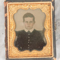 Lot 058 - Antique 1/9th Plate Ruby Ambrotype Photograph Of Stern Looking Young Boy With Tinted Details, In Split Half Leatherette Union Case