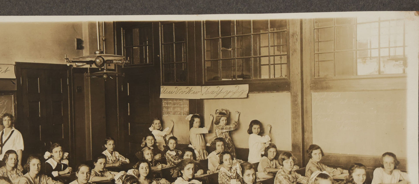 Lot 067 - Antique Boarded Interior Schoolroom Photograph Of Class Of Girls And Their Teacher (6th Grade), April 29, 1921, Partial Identification On Verso