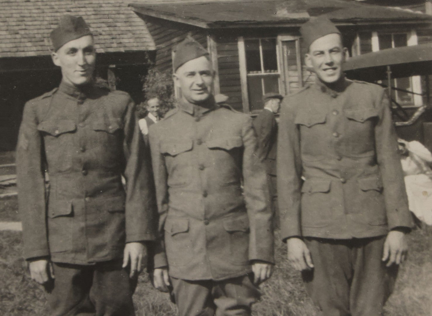 Lot 070 - Antique Boarded Photograph Of Three Smiling Doughboy WWI Soldiers, Likely Returned Home From War, Outside House
