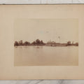Lot 071 - Antique Boarded Photograph Of Farmhouse With Long Farmers Porch On Lakeside Flying American Flag With Windmill With "Ideal" Advertisement