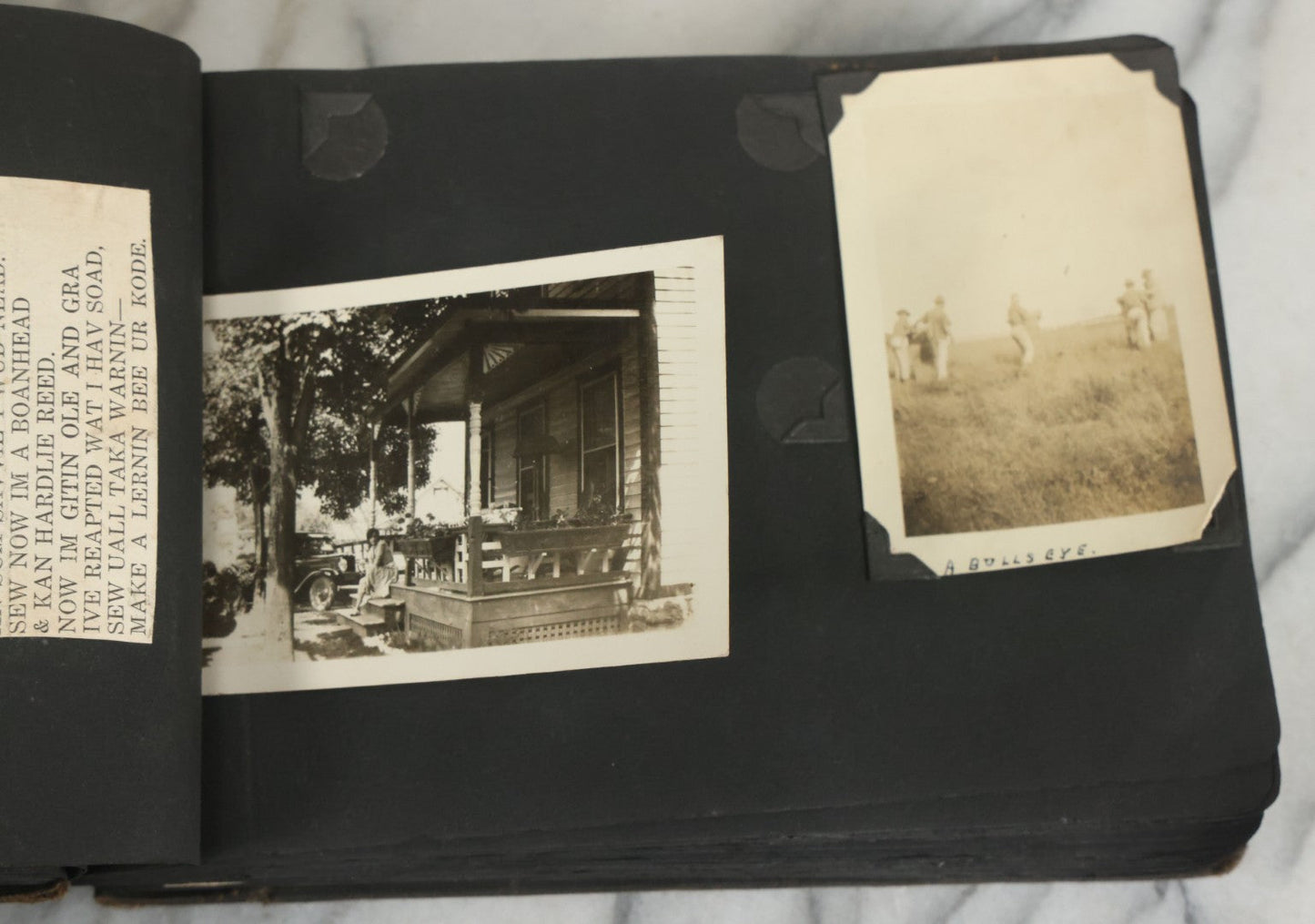 Lot 073 - Antique Snapshot Photo Album And Scrapbook With Black Cover Featuring Many Photos Of Military Men, Dogs, Hunting, Including Boxer Bill Ritchie, Circa 1920s, Belonged To F.D. Vance, Includes Poem Clippings