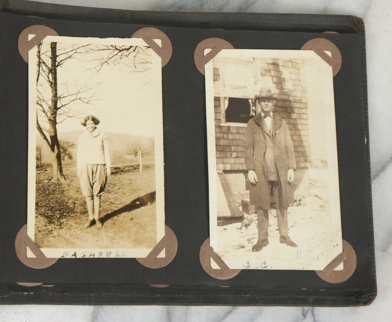 Lot 073 - Antique Snapshot Photo Album And Scrapbook With Black Cover Featuring Many Photos Of Military Men, Dogs, Hunting, Including Boxer Bill Ritchie, Circa 1920s, Belonged To F.D. Vance, Includes Poem Clippings