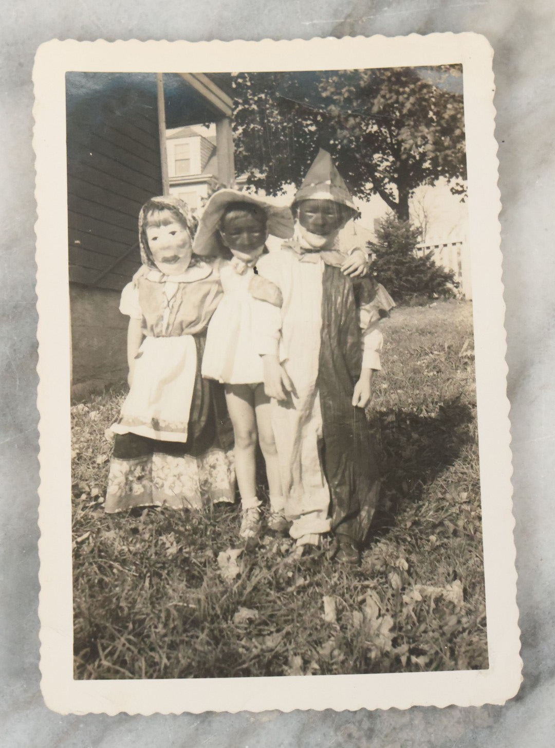 Lot 077 - Pair Of Vintage Snapshot Photographs Of 3 Children In Costume With Masks On Halloween, Circa 1944
