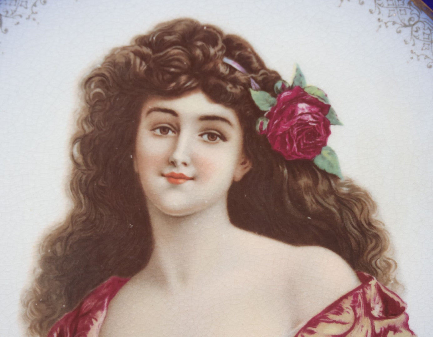 Lot 082 - Antique Decorative Transferware Plate With Blue Rim Featuring Pretty Woman With Long Brown Hair And Rose After G. Bonfits, By Royal La Belle, Wheeling Potteries Co., With Wire Hanger, 13" Diameter