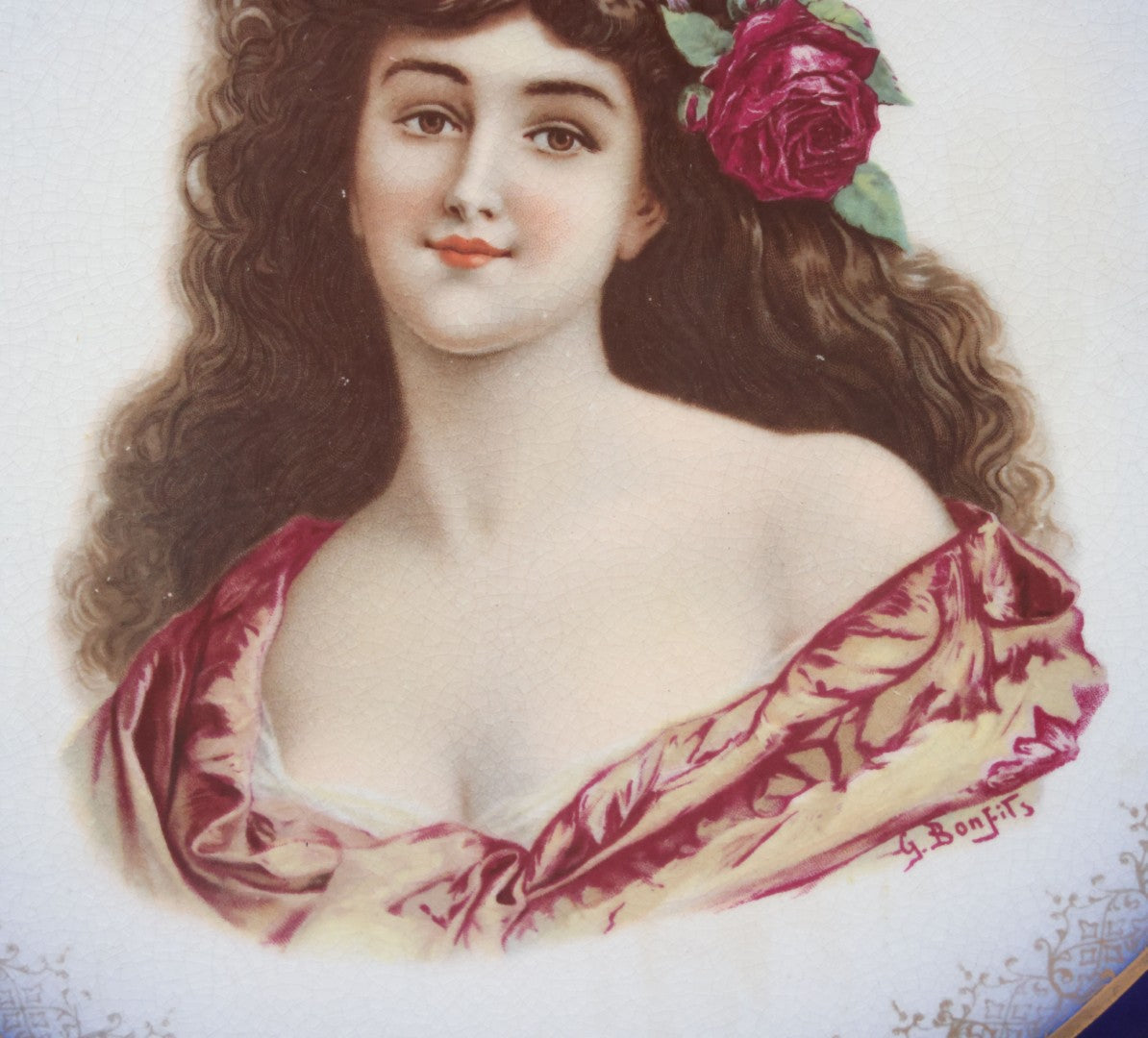 Lot 082 - Antique Decorative Transferware Plate With Blue Rim Featuring Pretty Woman With Long Brown Hair And Rose After G. Bonfits, By Royal La Belle, Wheeling Potteries Co., With Wire Hanger, 13" Diameter
